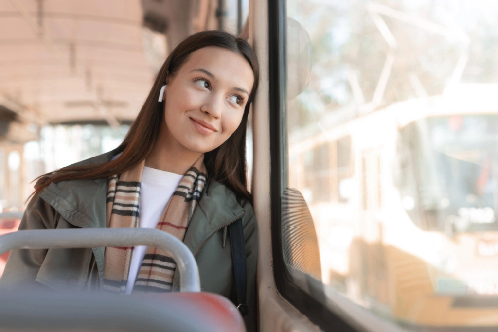 smiley-passenger-looking-outside-window-tram.jpg
